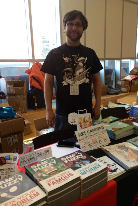 Sam's table at TCAF. The light was a bit difficult for a phone camera to deal with, so Sam's a bit, ah, fuzzy.