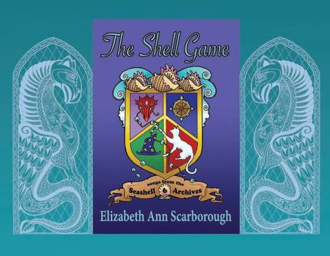Annie designed the shield in her beading program (she's a very talented beadweaver as well as writer!) and I made it into a book cover using the banner and shell ornaments I designed for the series. The dragons on either side are from one of my Celtic pen and ink drawings.